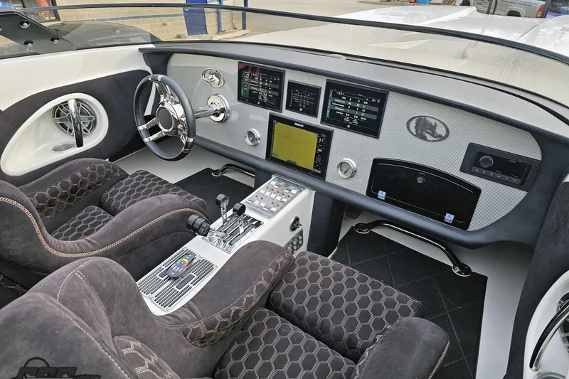 Slide: The Image of 2009 Nordic 36 Hurricane boat interior with modern dashboard and plush seating. - 79