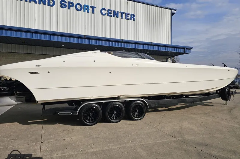 Slide: The Image of 2009 Nordic 36 Hurricane boat on trailer outside sport center. - 8