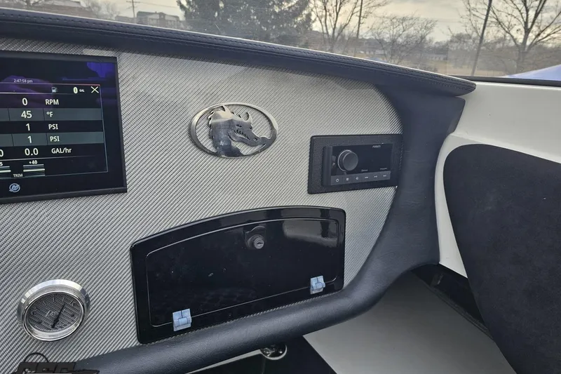 Slide: The Image of Dashboard of a 2009 Nordic 36 Hurricane boat with digital display and controls. - 82