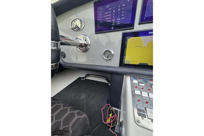 Slide: The Image of Dashboard of a 2009 Nordic 36 Hurricane boat with digital displays and controls. - 84