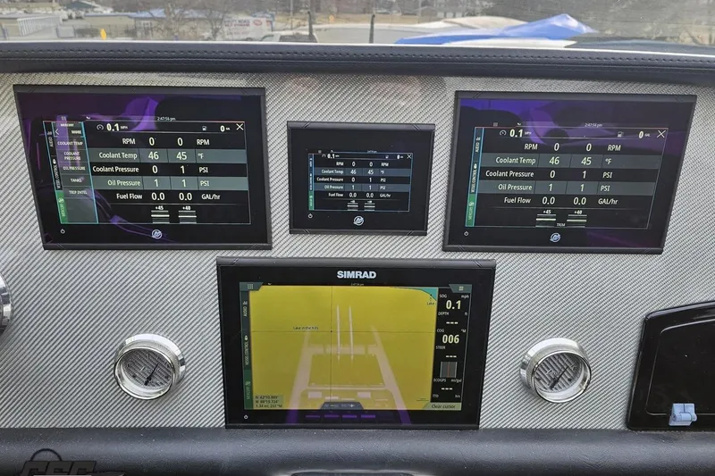 Slide: The Image of Dashboard of a 2009 Nordic 36 Hurricane boat with digital displays and gauges. - 87