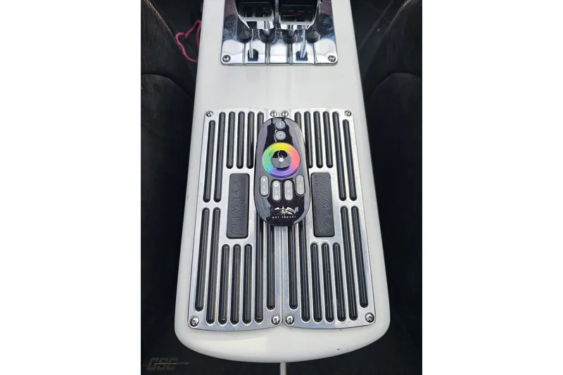 Slide: The Image of Control panel of a 2009 Nordic 36 Hurricane boat with remote and switches. - 88