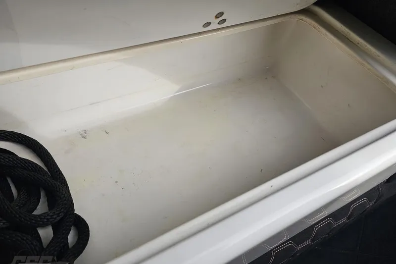 Slide: The Image of Empty storage compartment with black rope in a 2009 Nordic 36 Hurricane boat. - 93