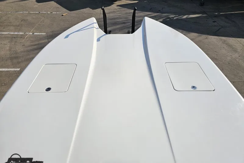 Slide: The Image of 2009 Nordic 36 Hurricane boat deck, featuring sleek white surface and storage compartments. - 98