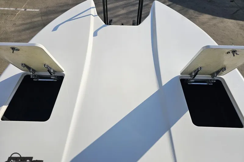 Slide: The Image of Open storage compartments on a 2009 Nordic 36 Hurricane boat deck. - 99