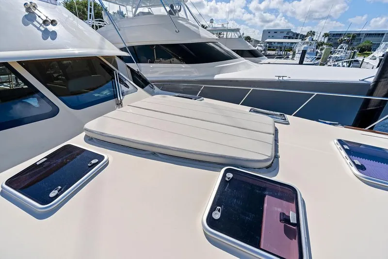 Slide: The Image of 2018 Palm Beach Motor Yachts PB55 Flybridge, docked with sunroof and hatches visible. - 20
