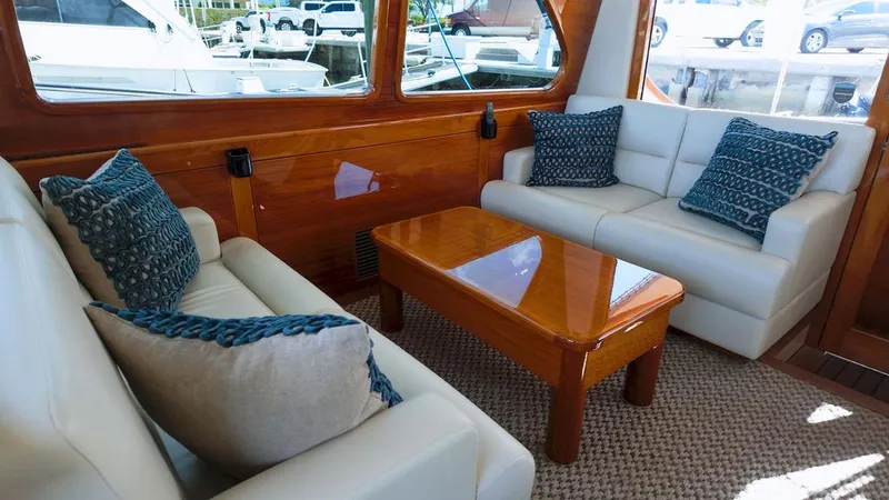 Slide: The Image of Luxurious interior of 2018 Palm Beach Motor Yachts PB55 Flybridge with elegant seating and wooden accents. - 31