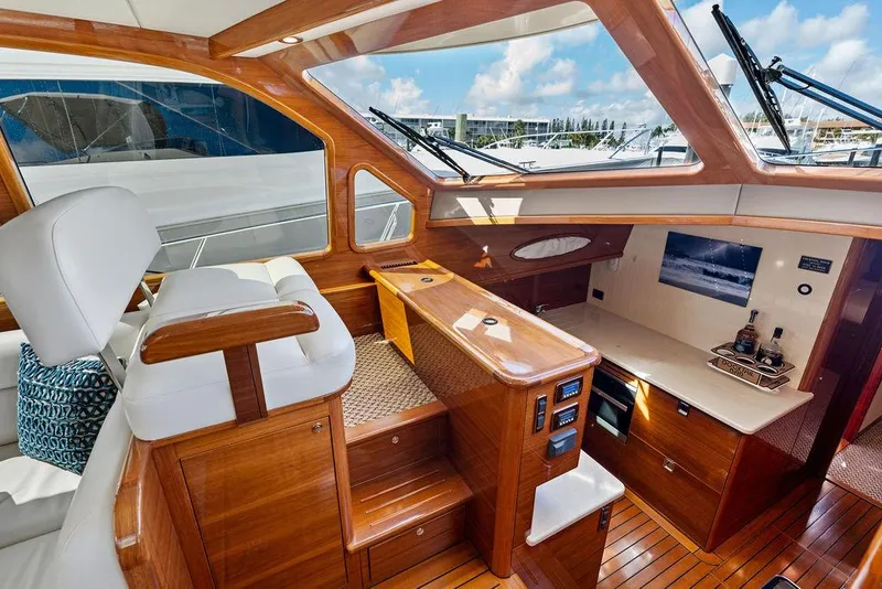 Slide: The Image of Luxurious interior of 2018 Palm Beach Motor Yachts PB55 Flybridge with elegant wood finish. - 40