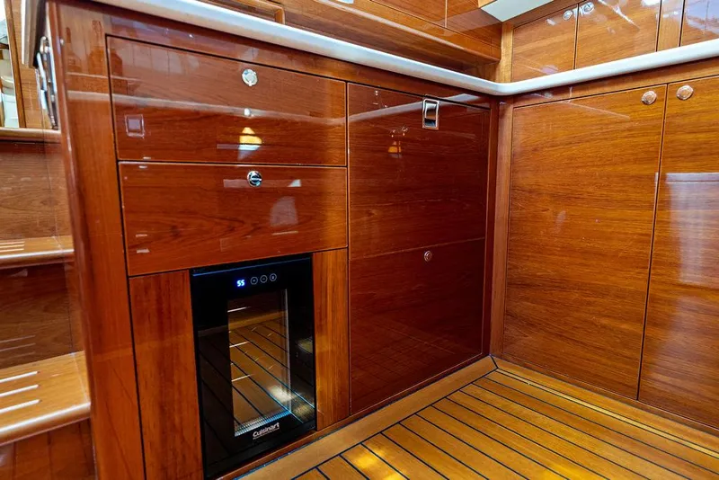 Slide: The Image of Luxurious wooden interior of 2018 Palm Beach Motor Yachts PB55 Flybridge with built-in wine cooler. - 45
