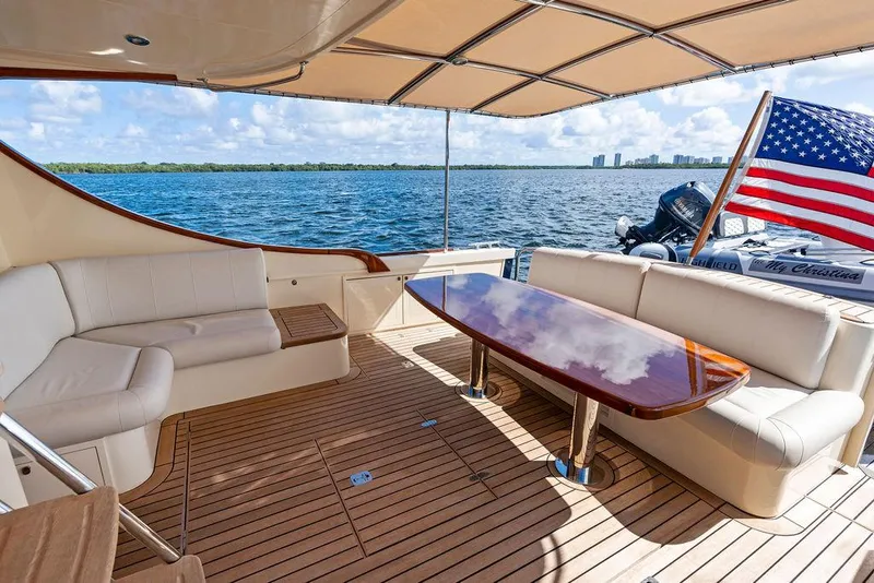 Slide: The Image of Luxurious 2018 Palm Beach Motor Yachts PB55 Flybridge with elegant seating and ocean view. - 9