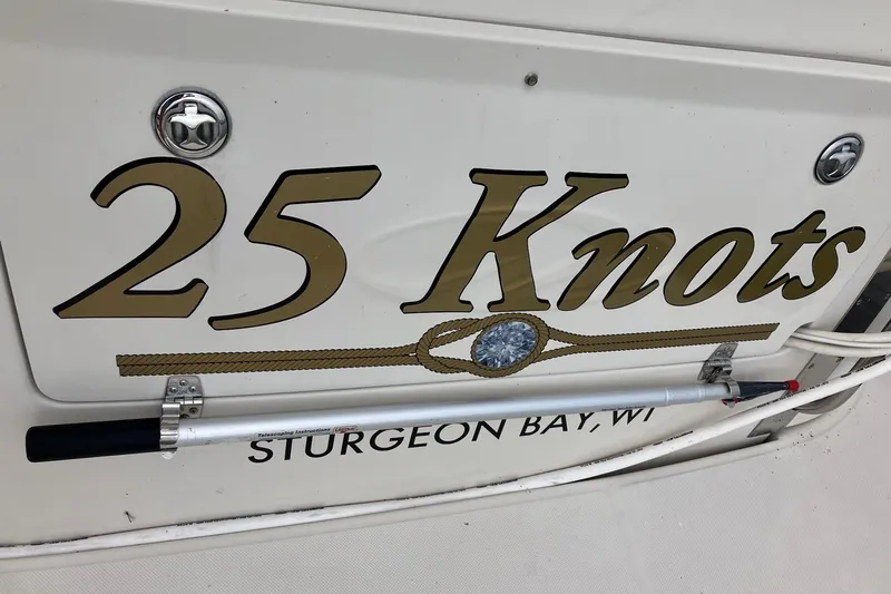 Slide: The Image of 2001 Regal Commodore 3780 boat with "25 Knots" text, Sturgeon Bay, WI. - 13