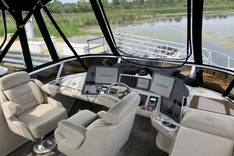 Slide: The Image of Luxurious helm of 2001 Regal Commodore 3780 with Garmin navigation systems. - 18