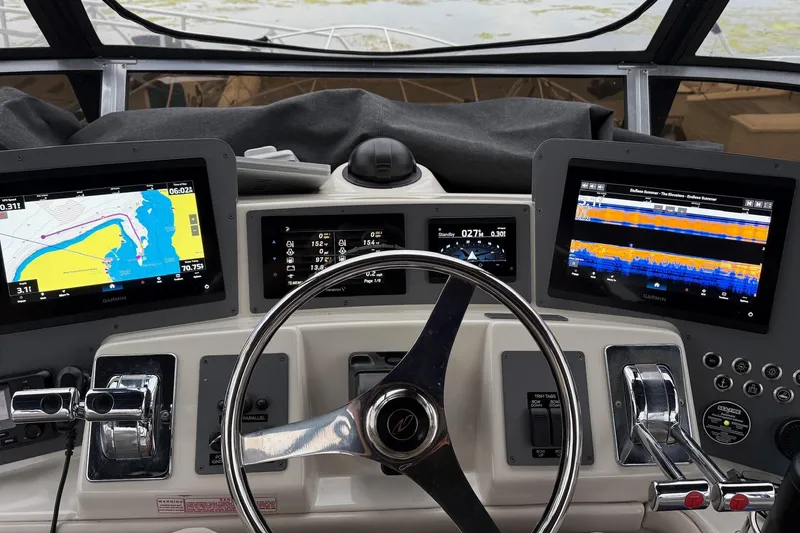 Slide: The Image of Cockpit of 2001 Regal Commodore 3780 with navigation screens and controls. - 19