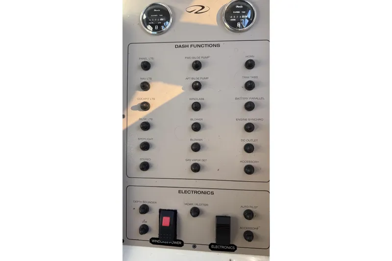 Slide: The Image of Control panel of a 2001 Regal Commodore 3780 boat with various switches and gauges. - 24