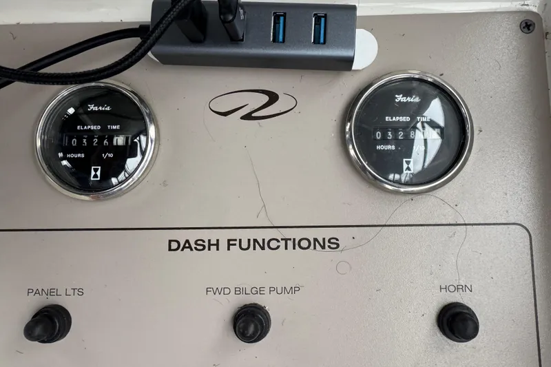 Slide: The Image of Dashboard of 2001 Regal Commodore 3780 with hour meters and control switches. - 25