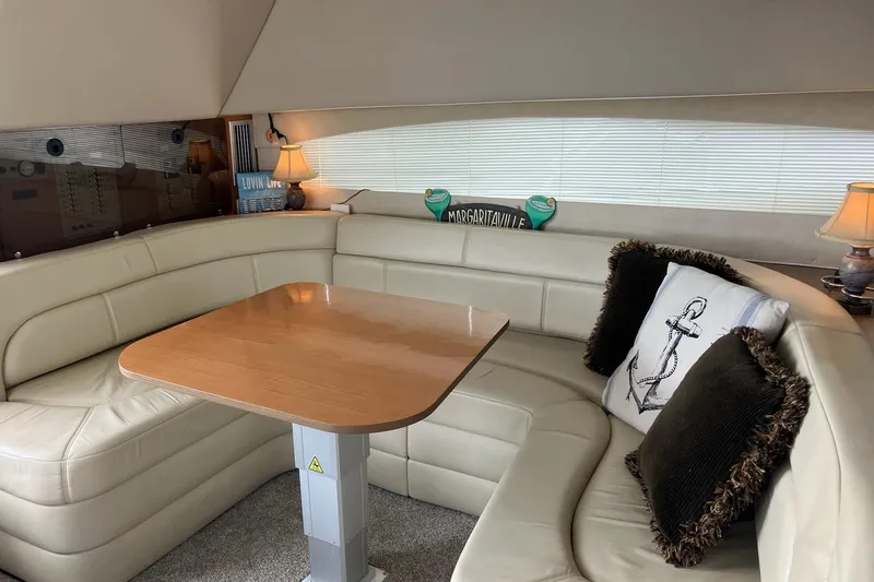 Slide: The Image of Luxurious 2001 Regal Commodore 3780 yacht interior with plush seating and elegant decor. - 30