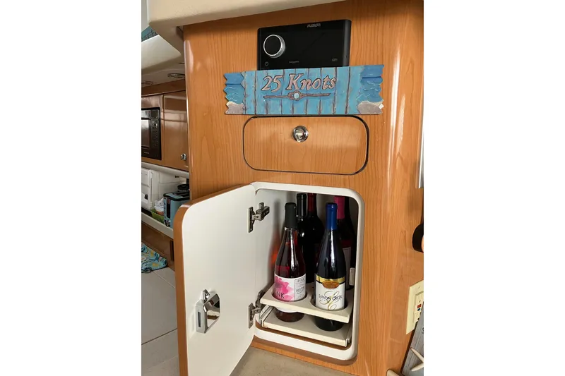 Slide: The Image of Wine storage cabinet in 2001 Regal Commodore 3780 yacht interior. - 34