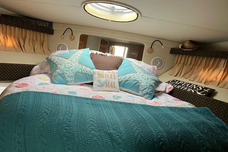 Slide: The Image of Cozy cabin interior of 2001 Regal Commodore 3780 with nautical-themed bedding. - 35