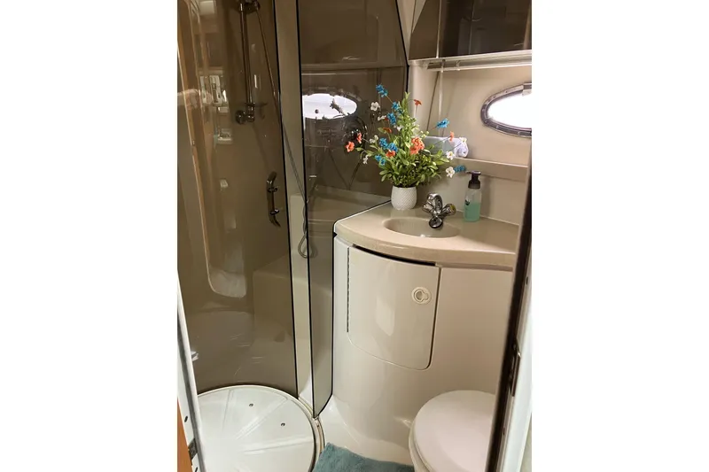 Slide: The Image of Bathroom interior of 2001 Regal Commodore 3780 yacht with shower and floral decor. - 38