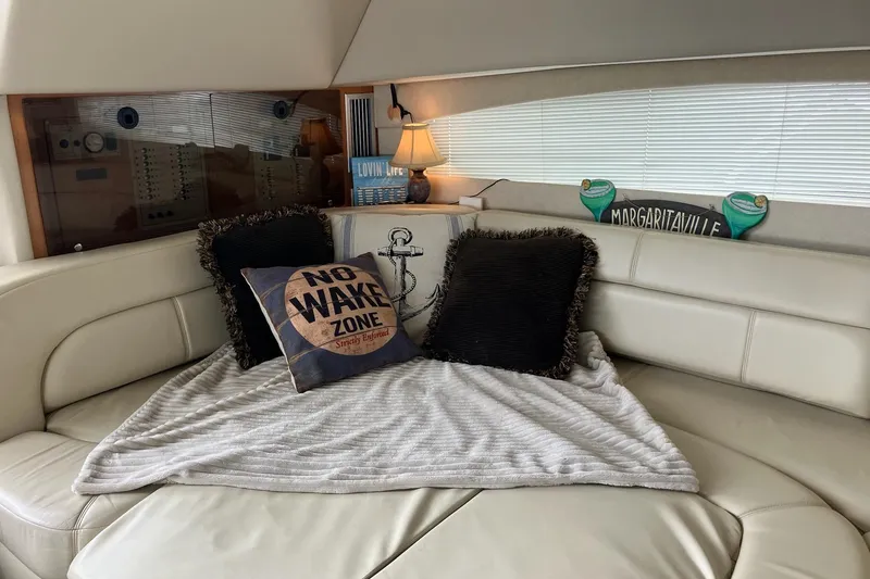 Slide: The Image of Cozy interior of 2001 Regal Commodore 3780 yacht with decorative pillows and lamp. - 39