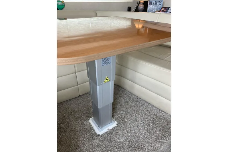 Slide: The Image of Luxurious interior of 2001 Regal Commodore 3780 yacht with wooden table and plush seating. - 40