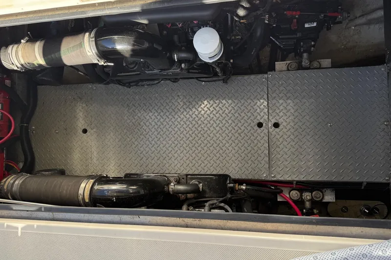 Slide: The Image of Engine compartment of a 2001 Regal Commodore 3780 boat with visible components. - 41