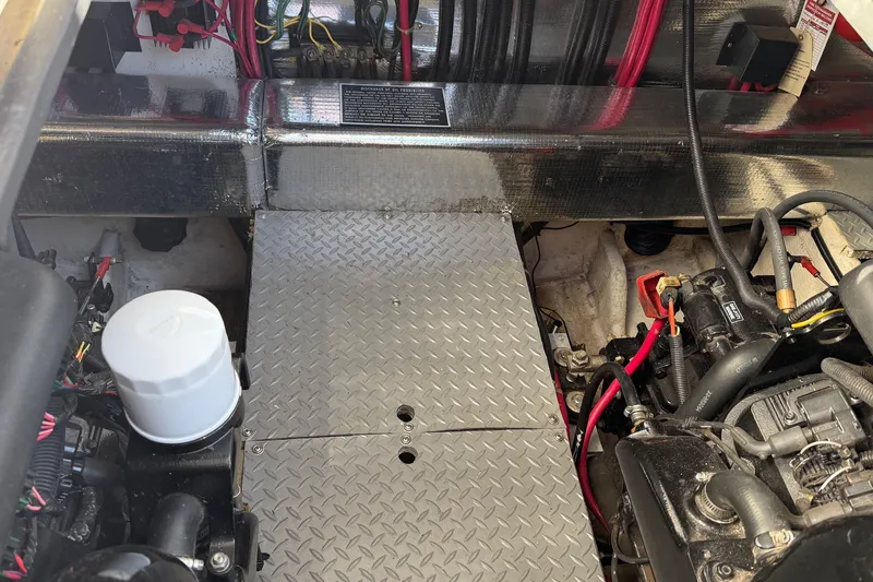 Slide: The Image of Engine compartment of a 2001 Regal Commodore 3780 boat, showing mechanical components and wiring. - 43