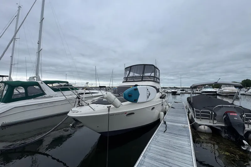 Slide: The Image of 2001 Regal Commodore 3780 yacht docked at marina under cloudy skies. - 6
