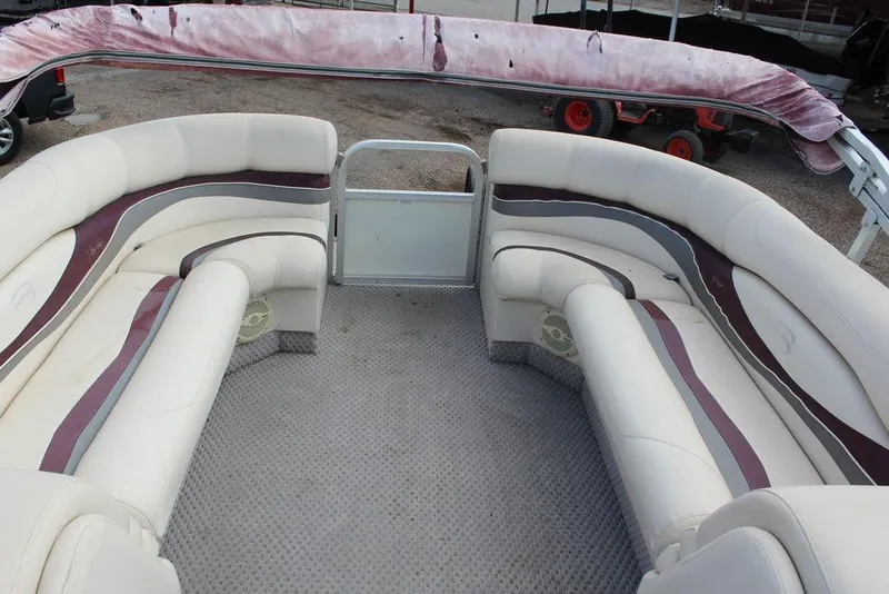 Slide: The Image of Interior of a 2005 Bennington 2275 RL pontoon boat with plush seating. - 16