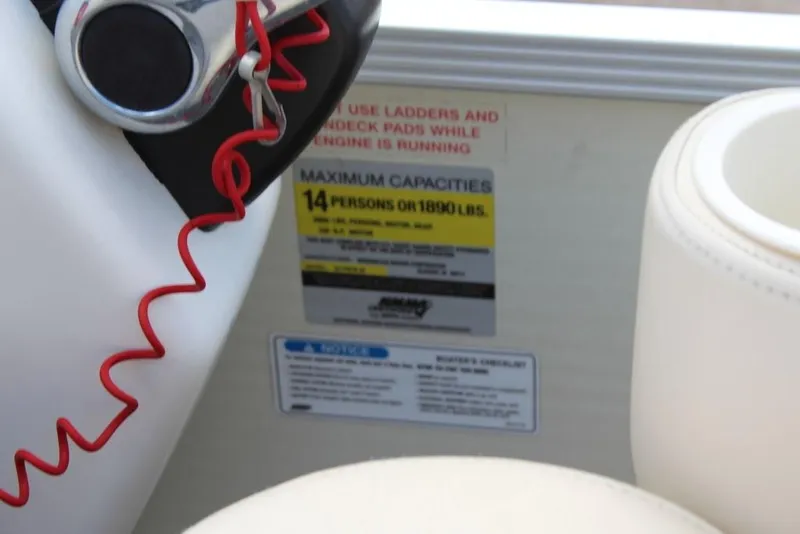 Slide: The Image of 2005 Bennington 2275 RL boat capacity label, maximum 14 persons or 1890 lbs. - 17