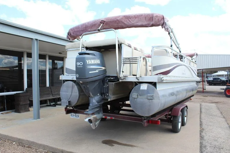 Slide: The Image of 2005 Bennington 2275 RL pontoon boat with Yamaha 90 outboard motor on trailer. - 4
