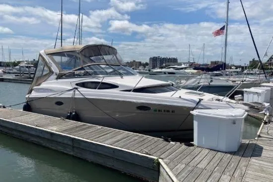 Slide: The Image of 2013 Regal 30 Express boat docked at marina under clear sky. - 15