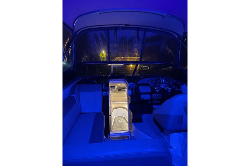 Slide: The Image of Interior of a 2013 Regal 30 Express boat illuminated with blue lighting. - 40