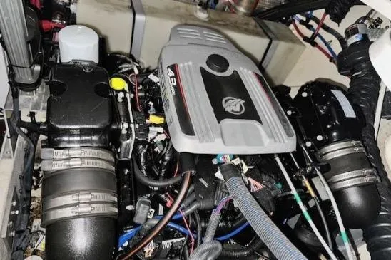 Slide: The Image of Engine compartment of a 2013 Regal 30 Express boat, showcasing mechanical components. - 42