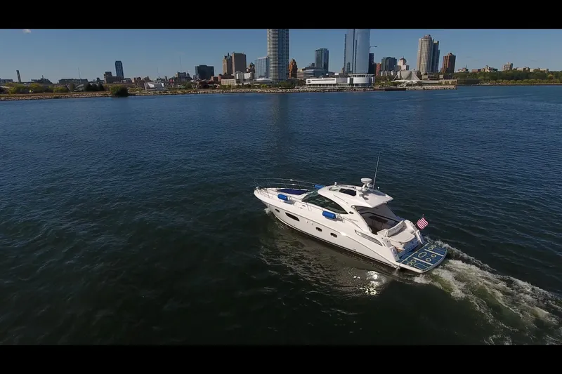 Slide: The Image of Aerial view of 2011 Sea Ray 470 Sundancer yacht cruising near city skyline. - 37