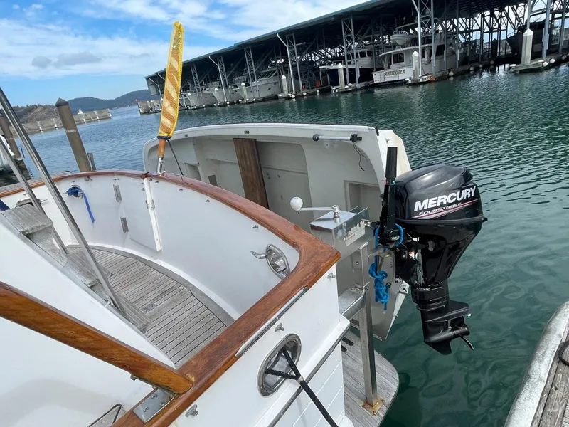 Slide: The Image of 1983 Ocean Alexander TRI Cabin boat with Mercury outboard motor at marina. - 10