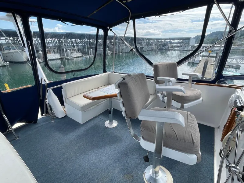 Slide: The Image of Interior of 1983 Ocean Alexander TRI Cabin yacht with seating and waterfront view. - 19