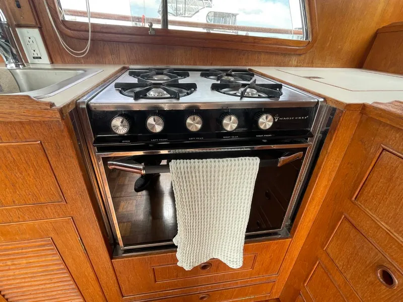Slide: The Image of 1983 Ocean Alexander TRI Cabin kitchen with gas stove and oven. - 32
