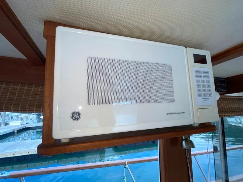 Slide: The Image of Microwave in 1983 Ocean Alexander TRI Cabin yacht kitchen. - 35