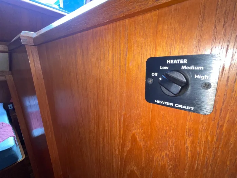 Slide: The Image of 1983 Ocean Alexander TRI Cabin heater control panel on wooden interior. - 36