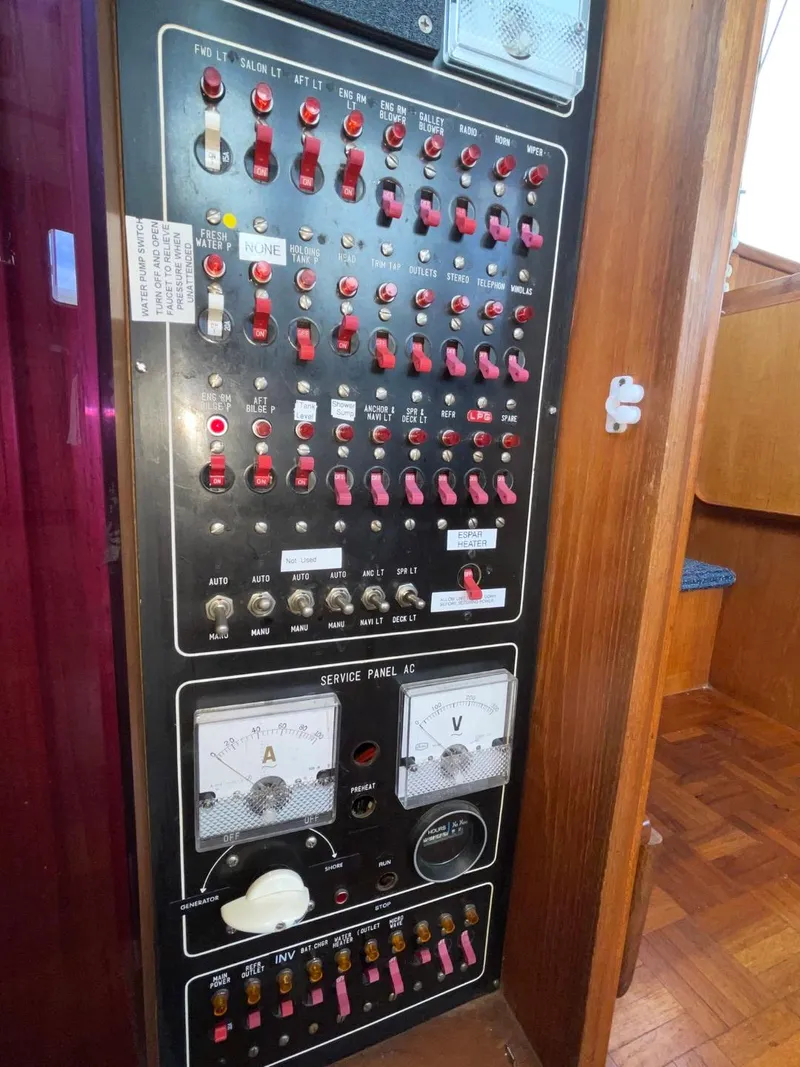 Slide: The Image of Control panel of 1983 Ocean Alexander 40 Double Cabin yacht with switches and gauges. - 39