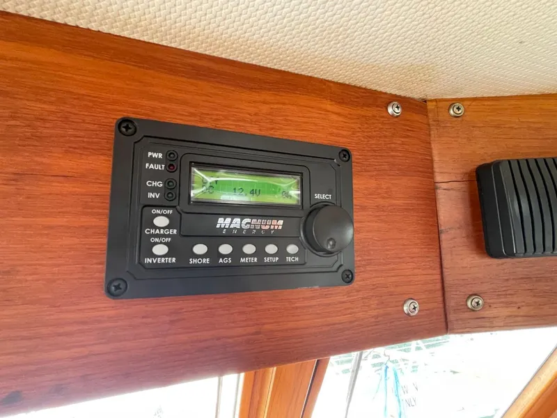 Slide: The Image of Control panel on 1983 Ocean Alexander 40 Double Cabin yacht, featuring Magnum inverter display. - 47