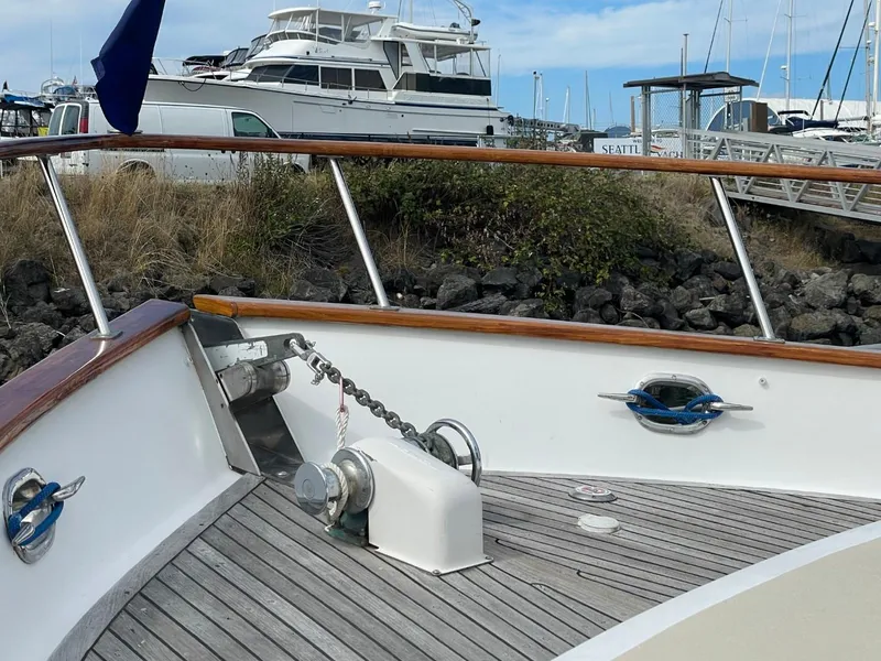 Slide: The Image of Bow deck of 1983 Ocean Alexander TRI Cabin yacht with anchor chain and winch. - 7