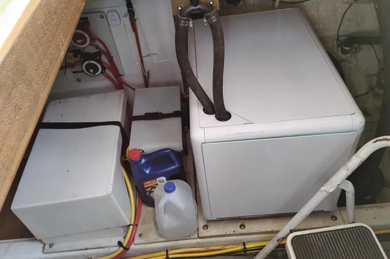 Slide: The Image of Engine room of 1983 Ocean Alexander 40 Double Cabin with equipment and supplies. - 78