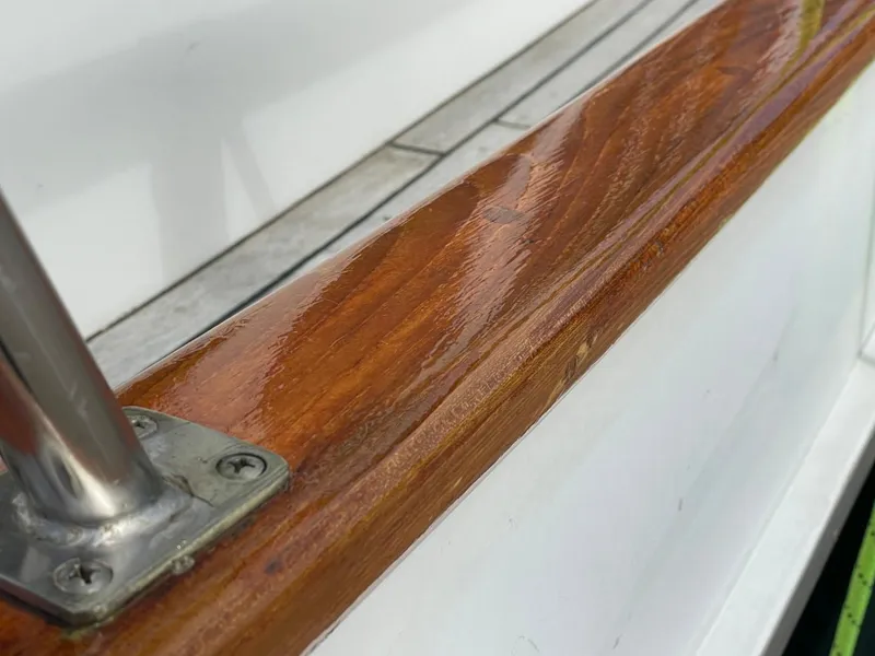 Slide: The Image of Close-up of polished wooden railing on 1983 Ocean Alexander TRI Cabin yacht. - 8