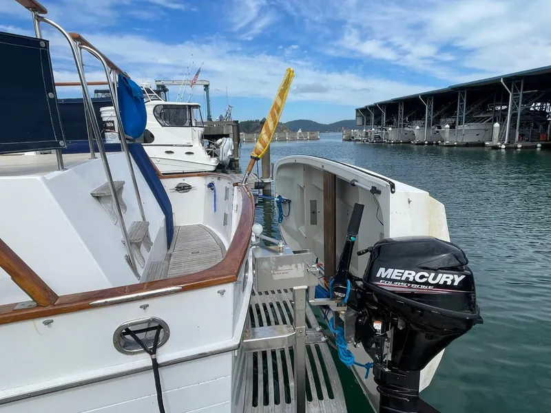 Slide: The Image of 1983 Ocean Alexander TRI Cabin yacht docked with Mercury outboard motor. - 9