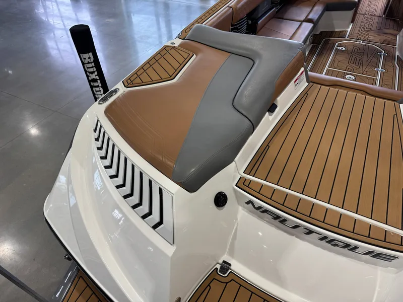 Slide: The Image of 2019 Nautique Super Air G25 boat rear with brown and gray upholstery. - 12