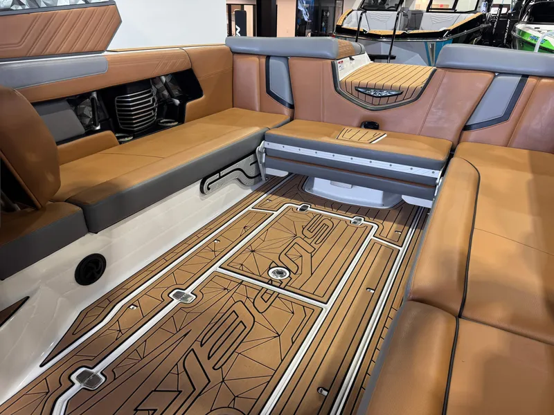 Slide: The Image of Interior of 2019 Nautique Super Air Nautique G25 with brown leather seating. - 15