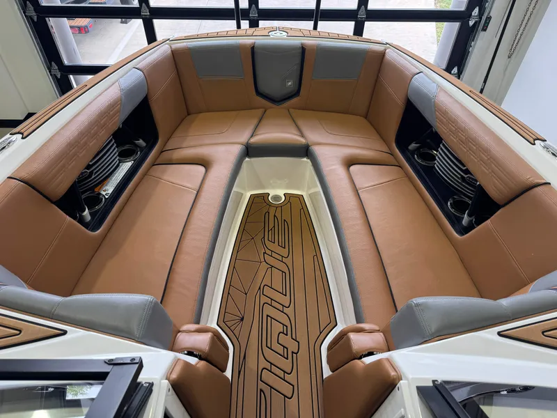Slide: The Image of Interior of 2019 Nautique Super Air Nautique G25 with brown leather seating. - 17