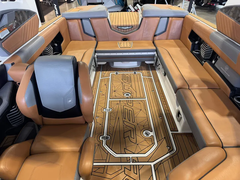 Slide: The Image of Interior of a 2019 Nautique Super Air Nautique G25 with luxurious leather seating. - 22